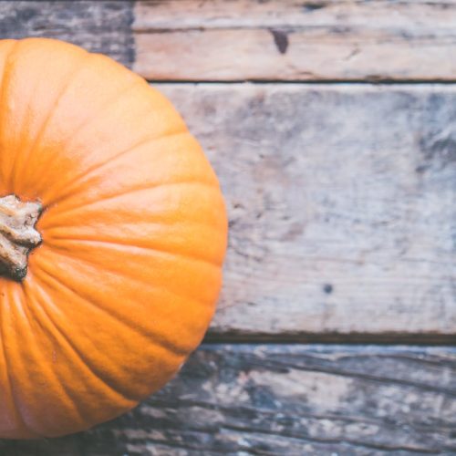 Pumpkin on Brown Wooden Surface